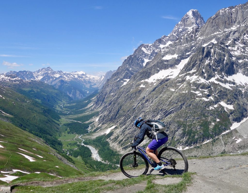 Mountain Biker Riding depending in the Alps