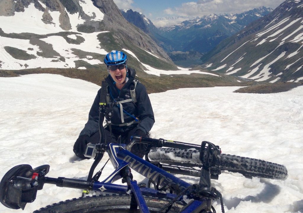 Mountain Biker fallen off in the snow