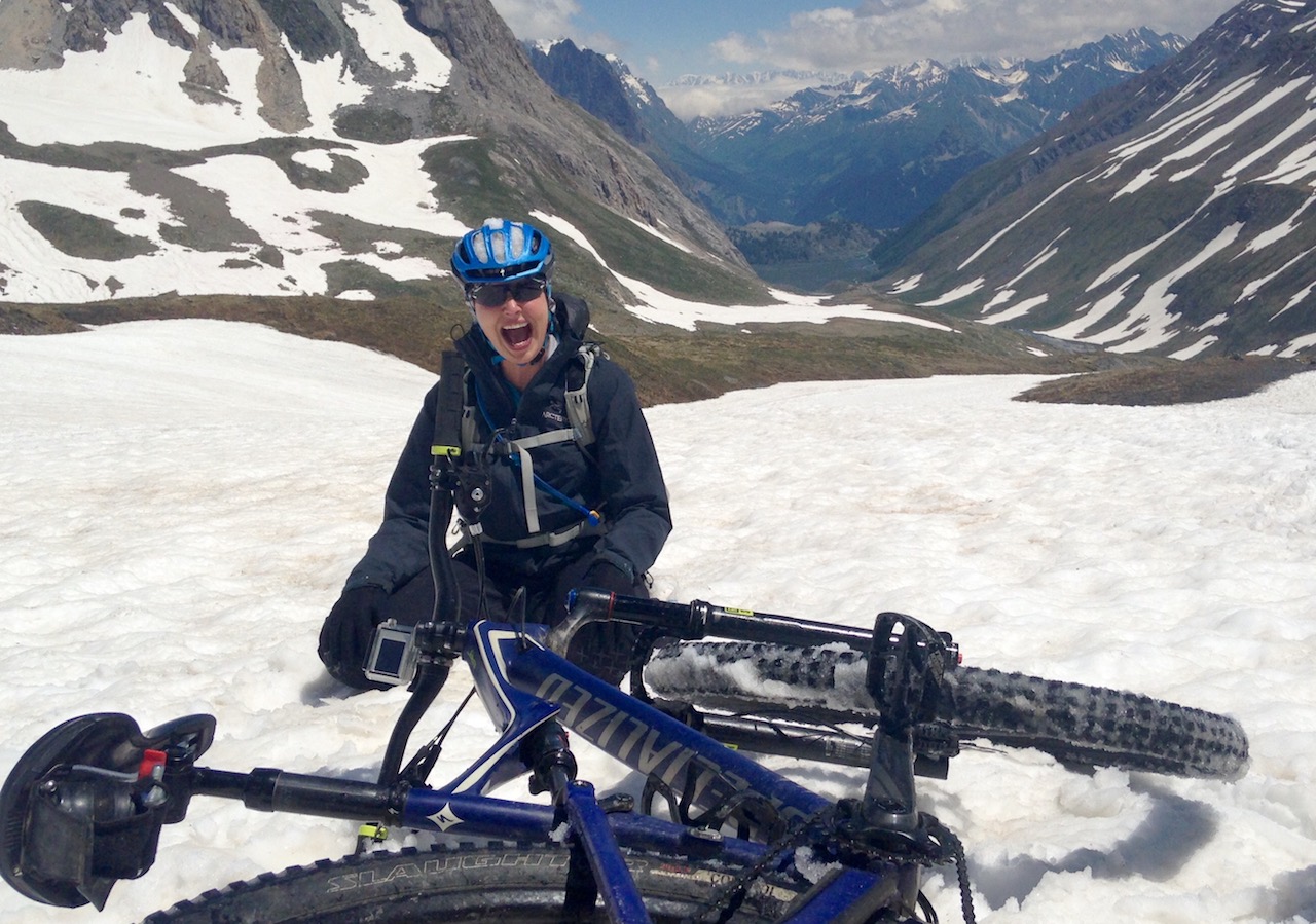 Mountain Biker fallen off in the snow