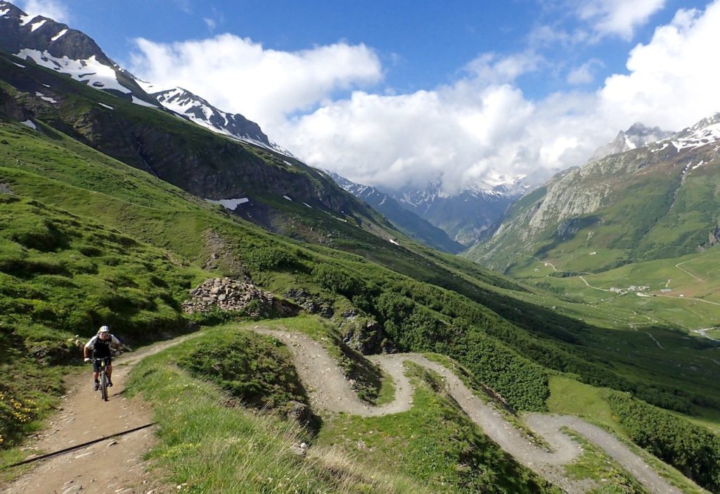 Mountain Biker Climbing the switchbacks on The Tour Du Mont Blanc